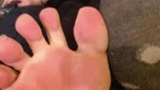 Feet show, one sock on one sock off