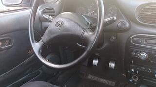 A beautiful lady driving a car and pumping the pedals (3)