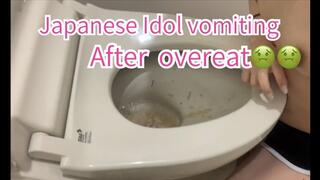 A cute Japanese girl vomiting in the bathroom after overeat