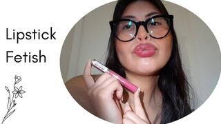 Touching up my lips with my lipstick