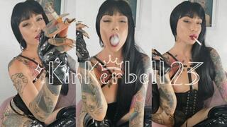 Human ashtray wearing PVC and Leather gloves
