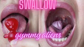 Swallow aliens gummy bears in