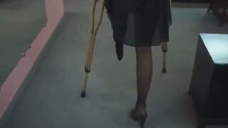 Amputee SBK crutching with high heel and stockings