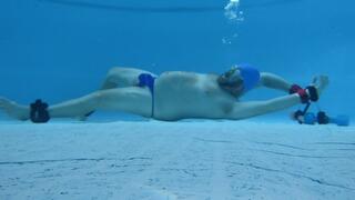 Blue thong and swim cap underwater bondage