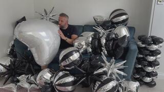 JL blows up a huge heart Mylar balloon