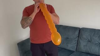 JL blows to pop wiggly balloons