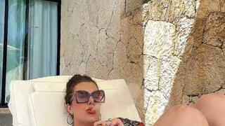 BBW stepmom relaxing while smoking a delicious cigar