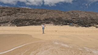 Swimming in jeans and t shirt in the ocean underwater