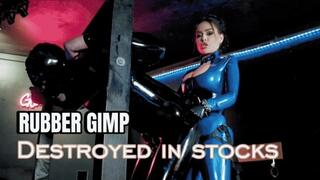 Rubber gimp Pegging in the stocks | Evilwoman