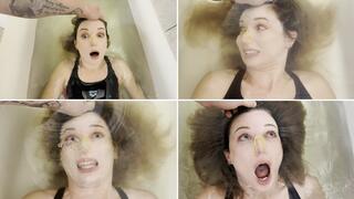 The guy POV holds Milana underwater