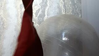 Val on yoga ball play with hearts balloons