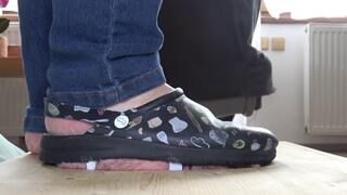 Crushing a slave's face in old shoes without soles