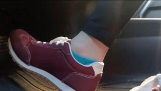 Evalynn driving a loaner truck in red sneakers 3