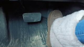 Evalynn driving the loaner in furry winter boots 1