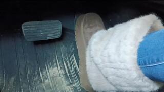 Evalynn driving the loaner in furry winter boots 3