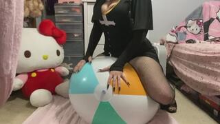Goth girl humps and pops giant beachball