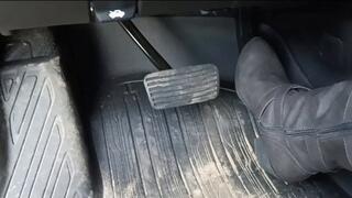 Evalynn revving the loaner in grey boots