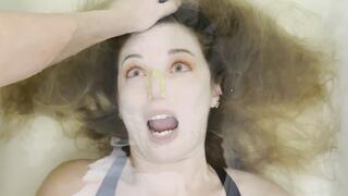 Milana is bound and held by hair underwater