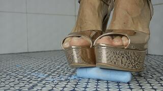 Gold high heels crush chalk tubes