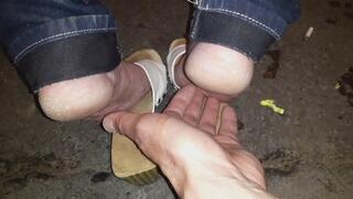 Bus stop wooden sandals bare soles tickling at public