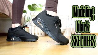 Modeling black skechers