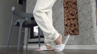 I wiggle my long toes in white slippers a