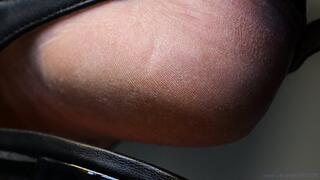 Foot fetish admiration, feet heels close-up, flat sandals. Feet skin particular fetish