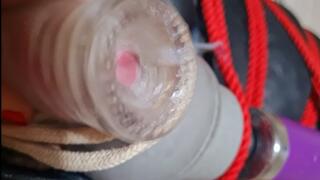 Post orgasm wand torment in leather bondage sack