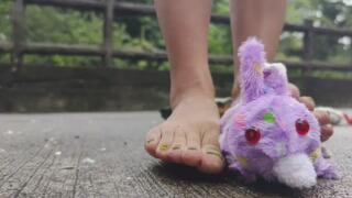 crushing stuffed Bunny barefoot