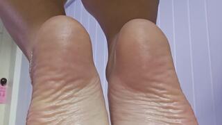 Quick, your GF is in the other room. Let my oiled soles take care of you