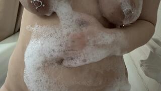 Married Milf takes a long hot bubbly bath and plays with her pierced sagging breasts