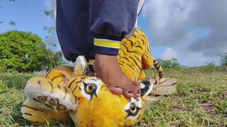 crushing orange stuffed tiger outdoor