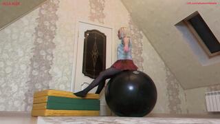 Fun jumping on a big pink beach ball and a black fitball