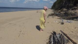 Juicy woman walking naked on beach