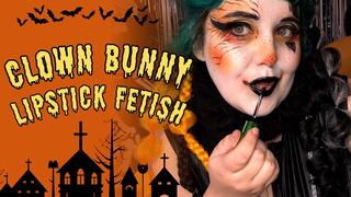 Clown Bunny reapplying her lipstick