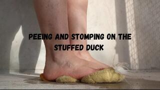 Peeing and stomping on the stuffed duck