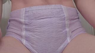 Wetting purple goodnite while sitting on toilet lid
