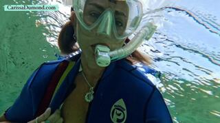 Vintage wetsuit at the edge of clear spring water and dark river water!