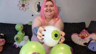 BBW Daisy quickly pops eyeball balloons with her nails