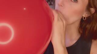 Empress Scarlett Blows up and big red balloon