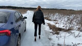sexy slender Alena walks in high-heeled sandals on ice
