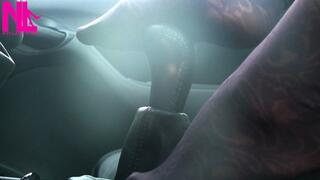 Caressing and footplaying with the wheel and the shift stick in violet patterned pantyhose