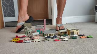Nikkichick crushes buildings & many small cars in flip flops with painted toe nails toy cars crush close ground view