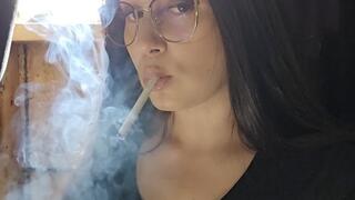 Pretty girl smoking for you in glasses in GORGEOUS sunlight