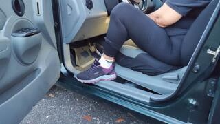 Diana Senior pedal pumping her car in socks and sneakers