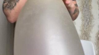 blowing more air in big long balloon