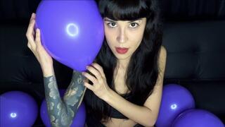 Having fun with purple balloons