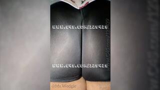 Jiggling her cheeks in spandex shorts