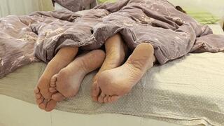 Flirting legs under the blanket bf