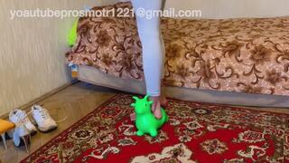 Nastya steps on an inflatable donkey, sits on it with all her weight, bounces her butt, and then crushes it with her high heels until it bursts. crush fetish and foot fetish + high heels and dirty sneakers and barefoot